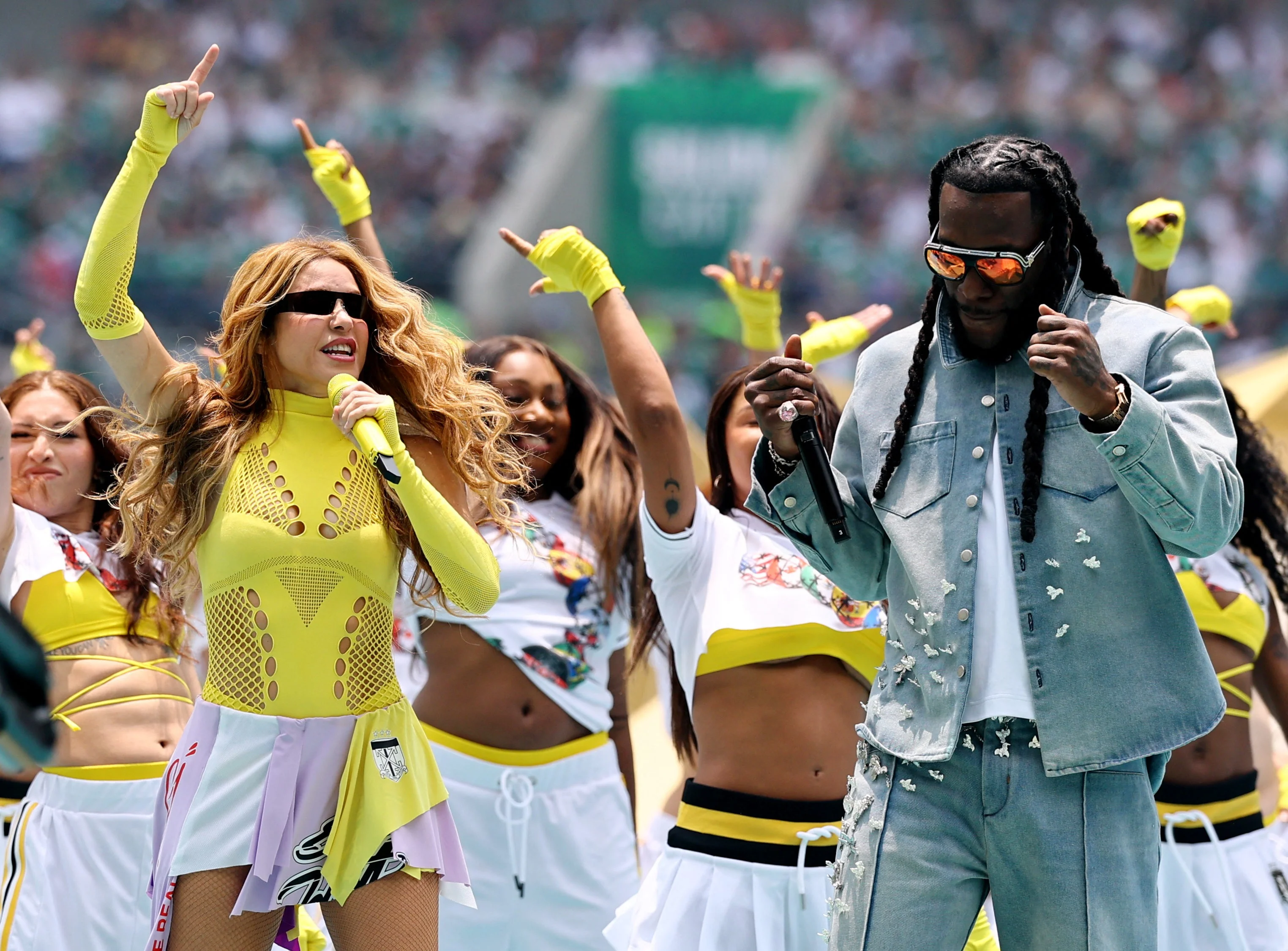 Shakira and Burna Boy perform during the opening ceremony