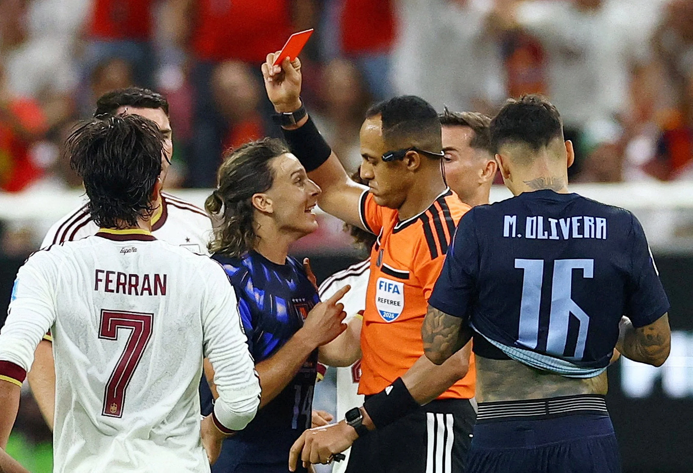 Uruguay's Agustin Canobbio is shown a red card by referee Ismail Elfath