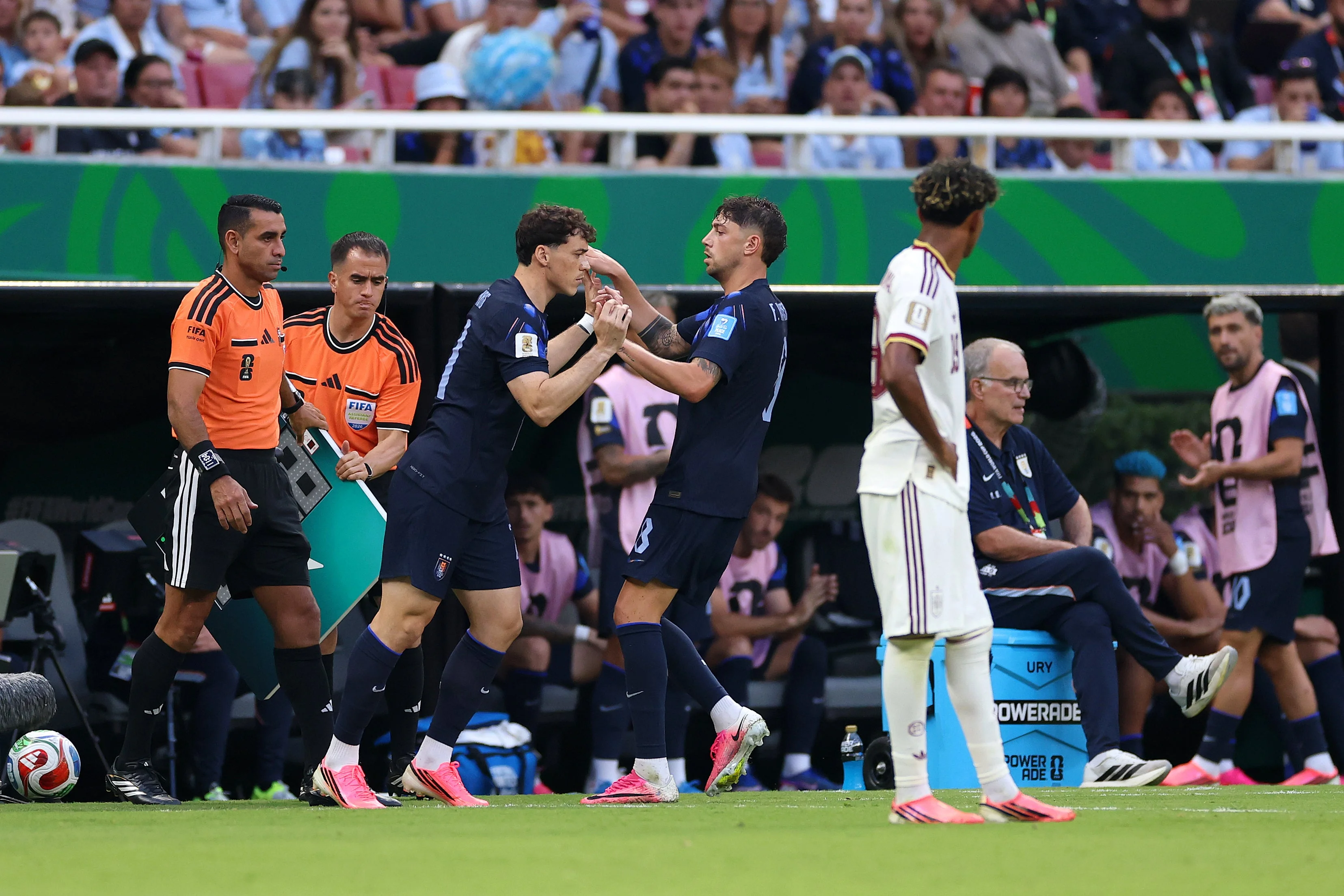 Federico Valverde comes off with Marcelo Bielsa looking on
