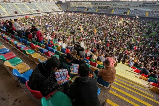 Soccer fans gather to trade Panini World Cup sticker albums and trading cards at the Bicentenario de La Florida stadium in Santiago, Chile, Sunday, May 31, 2026.
