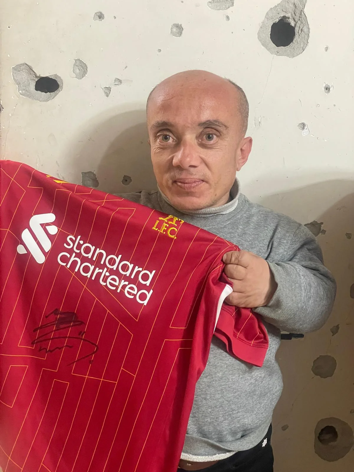 Haitham was gifted a signed t-shirt by Liverpool star Mohammed Salah