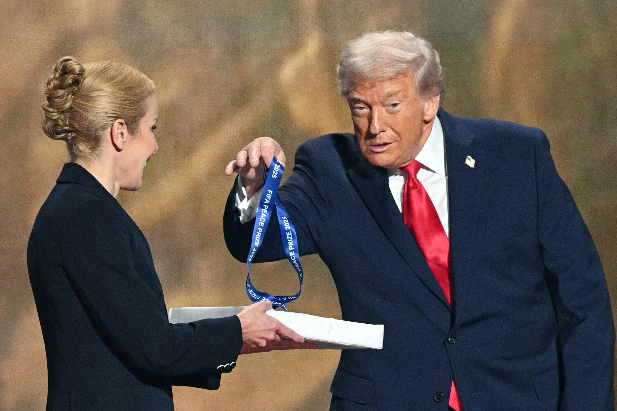 Trump accepts the inaugural Fifa Peace Prize during the draw for the World Cup at the Kennedy Center in December last year